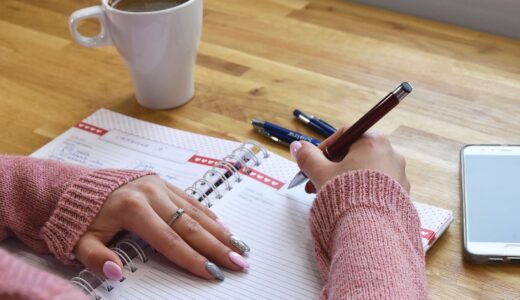 writing, notebook, planning, handwritten, coffee, pen, work, table, mobile phone, hand, office, study, writing pad, manicure, relaxation, page, wooden table, beautiful ring, calm, organizer, ai generated